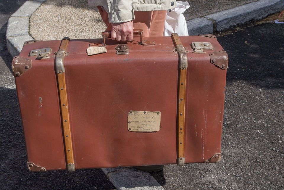 old fashioned suitcase with wheels